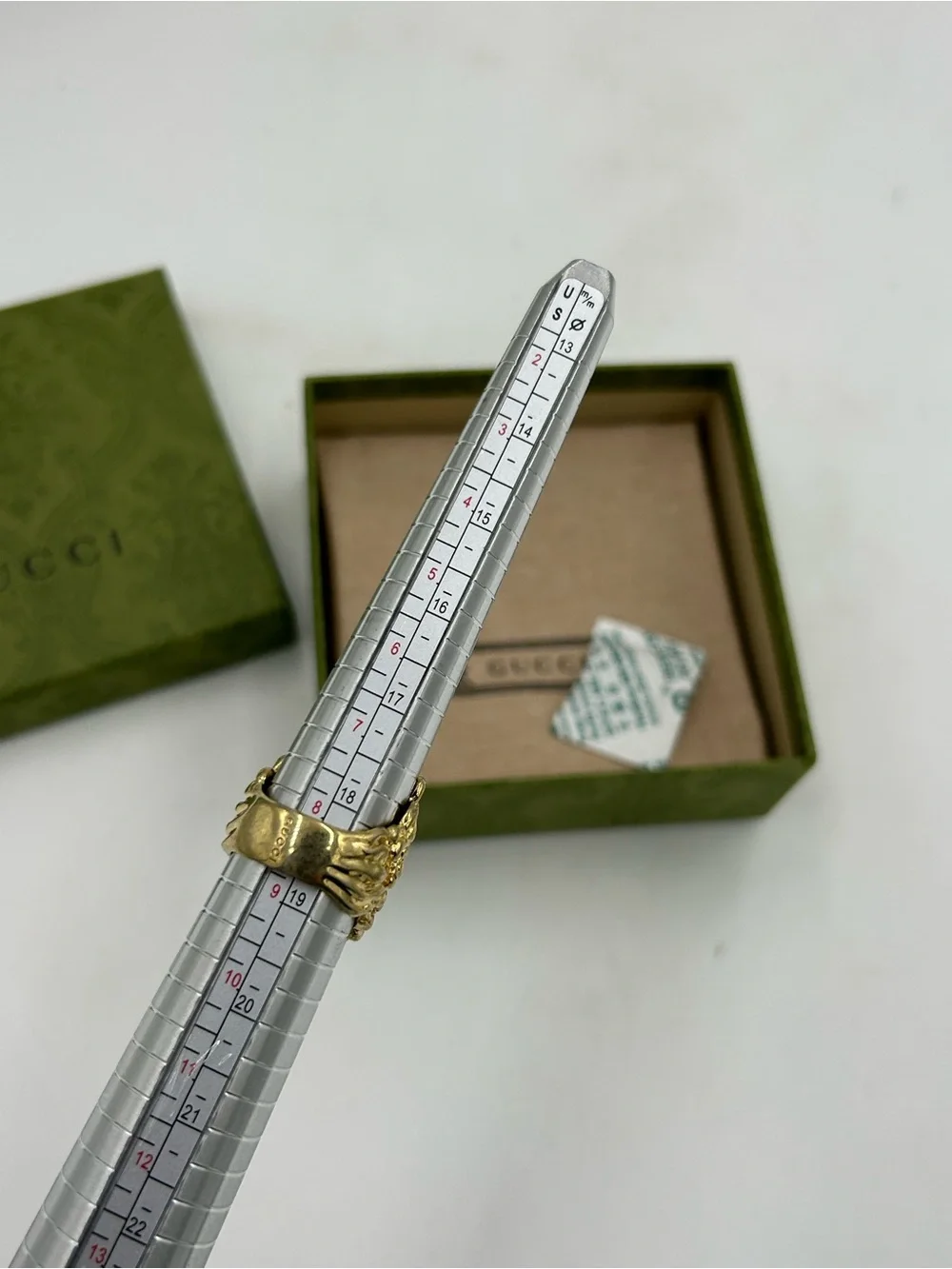 Unisex Gucci, Lionhead motif  gold tone with red crystal size 8.5 made in Italy